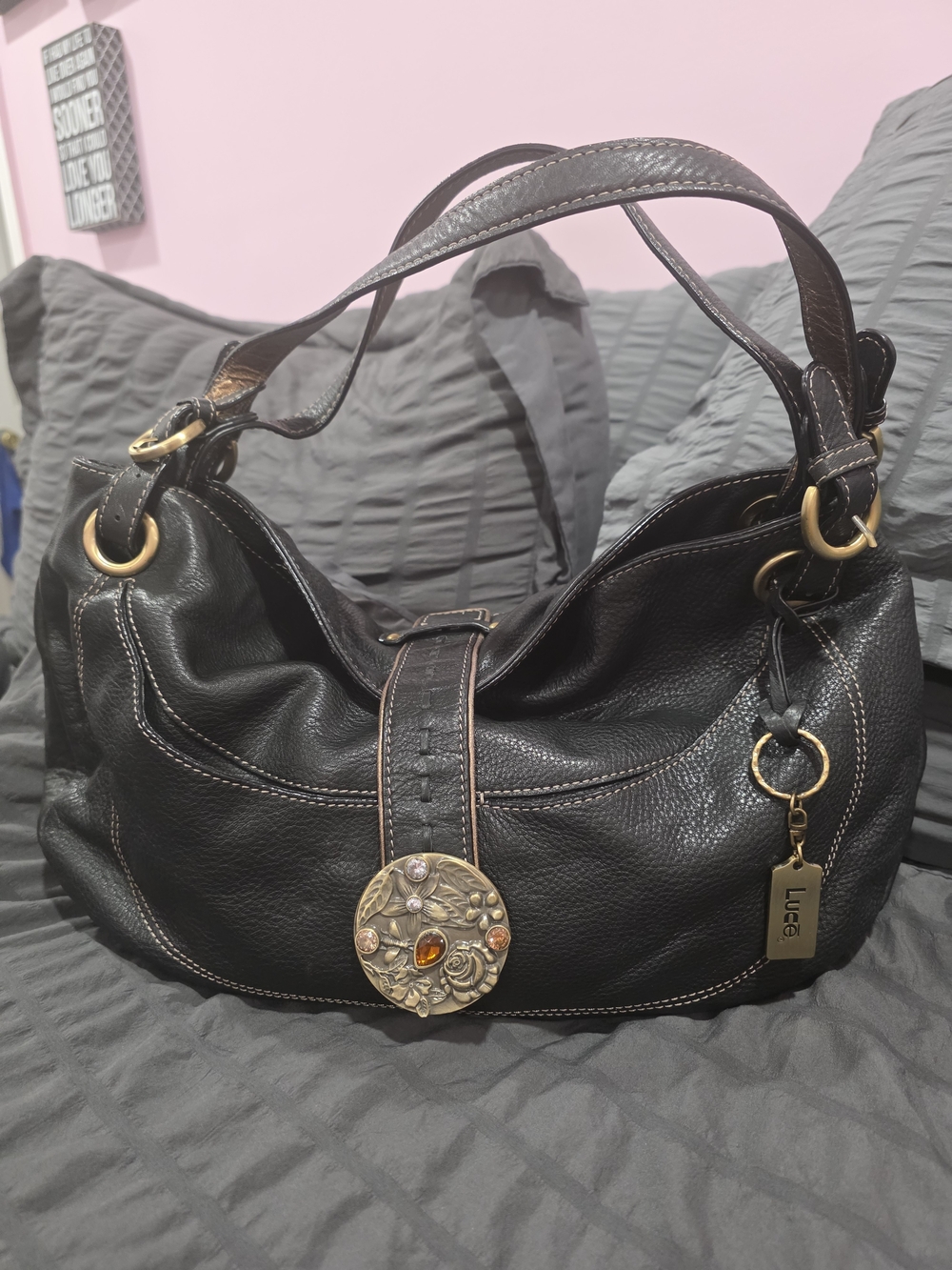 Luce Black Pebbled Leather Shoulder Bag with Decorative Medallion Accent